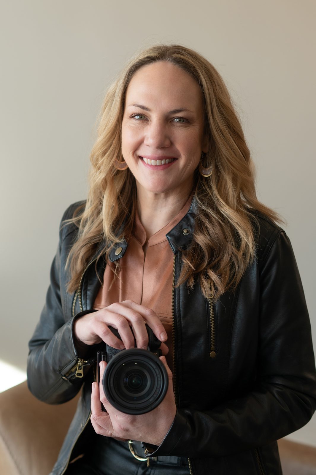 Steph Shanks with her camera — photographer headshot