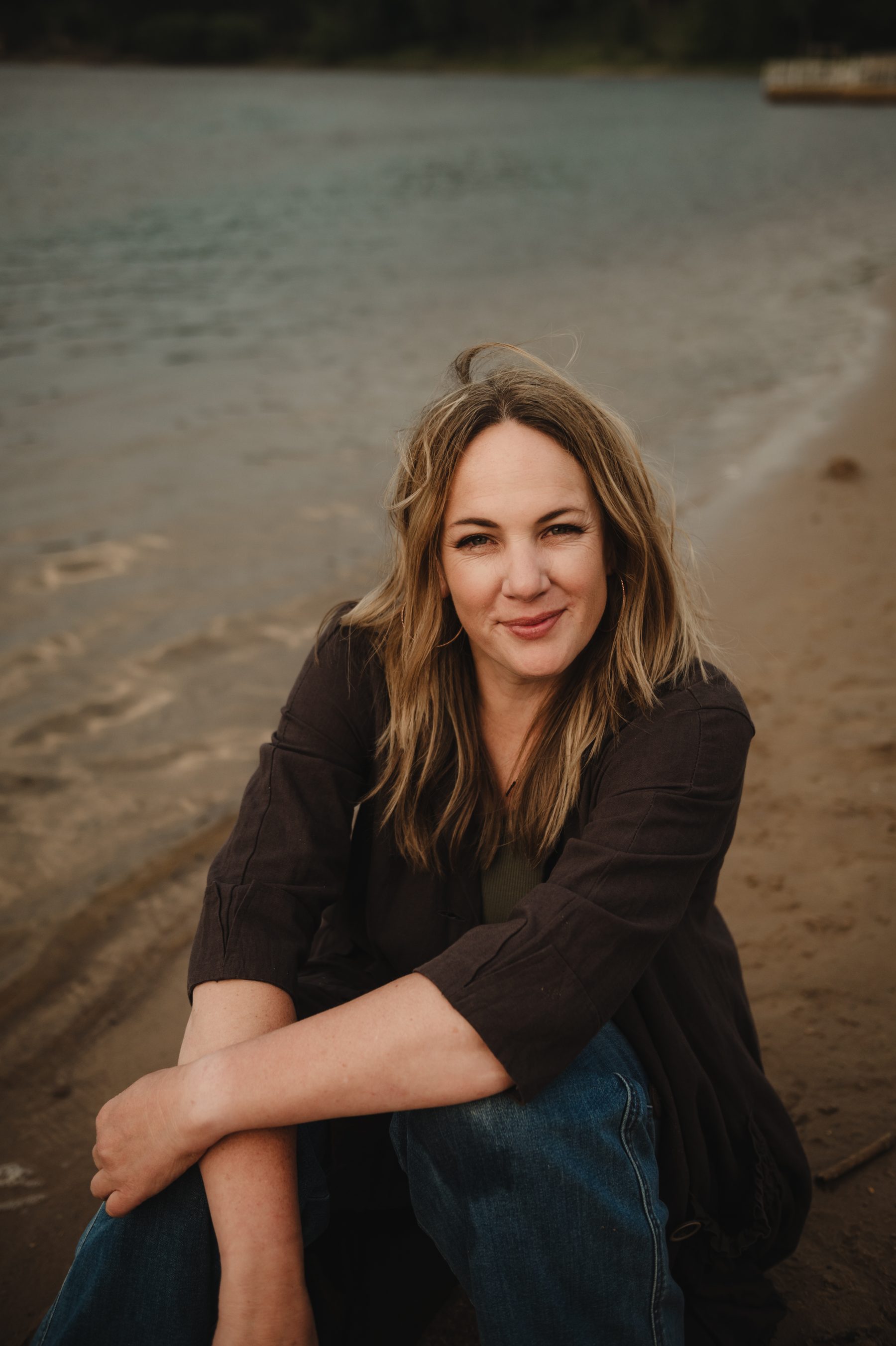 Steph Shanks sitting on the shore of Devil's Lake