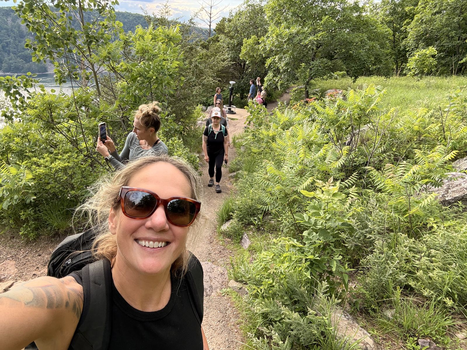 Women walking a wooded trail together